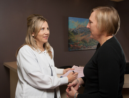 Dr. Jacqueline Bennett consults with a dental patient