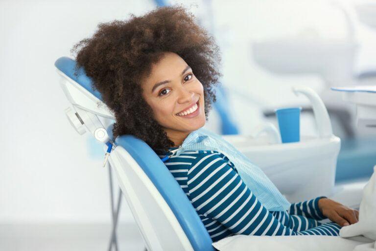 woman smiling sitting in dental chair